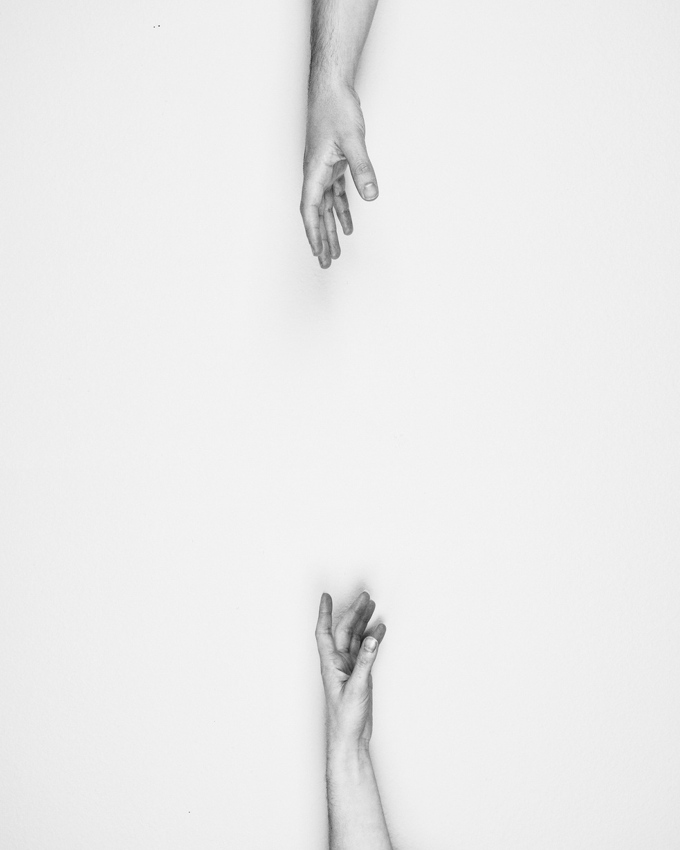 Hands Reaching Each Other